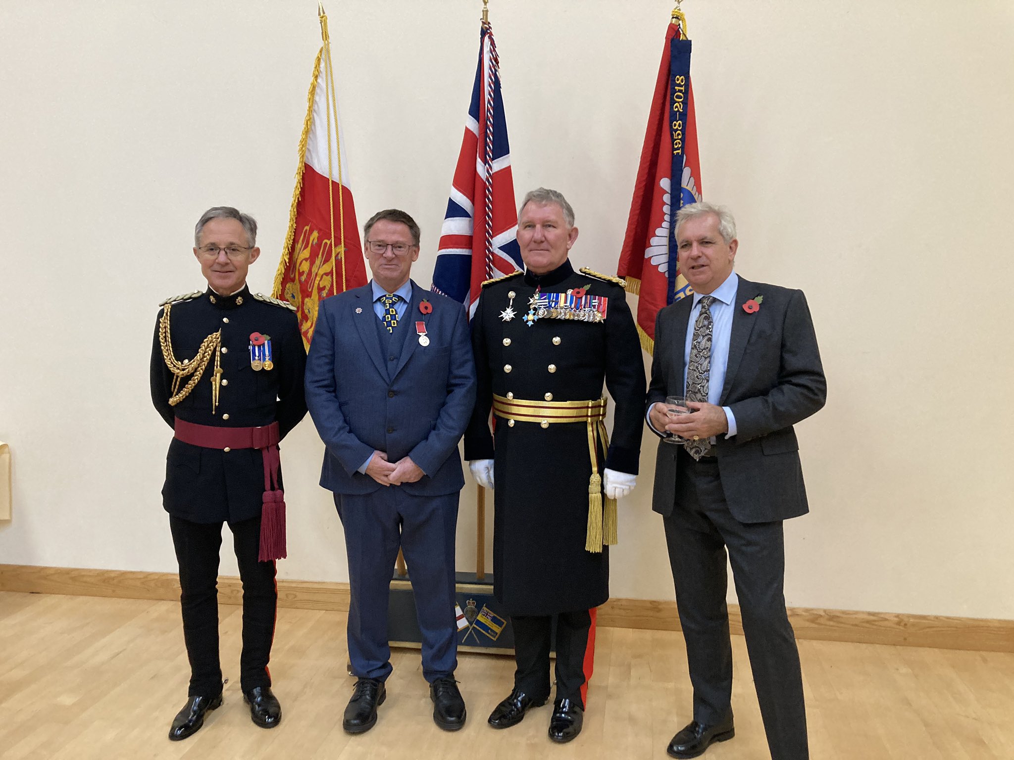 Presenting a BEM to Kevin Adams for his Services to the Community in Sark, October 28th 2023. Pictured with His Excellency's ADC, Major Marco Ciotti and the Seigneur of Sark Christopher Beaumont